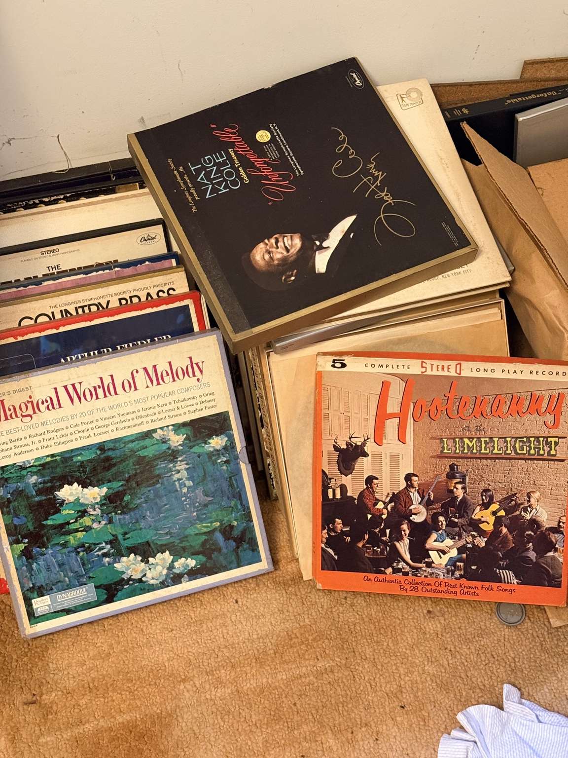 Vintage record albums including Nat King Cole